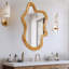 Miroir mural de forme irrégulière avec cadre en bois naturel