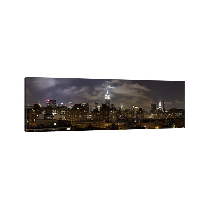 Buildings Lit Up At Night, Empire State Building, Manhattan - Wrapped Canvas Panoramic Print
