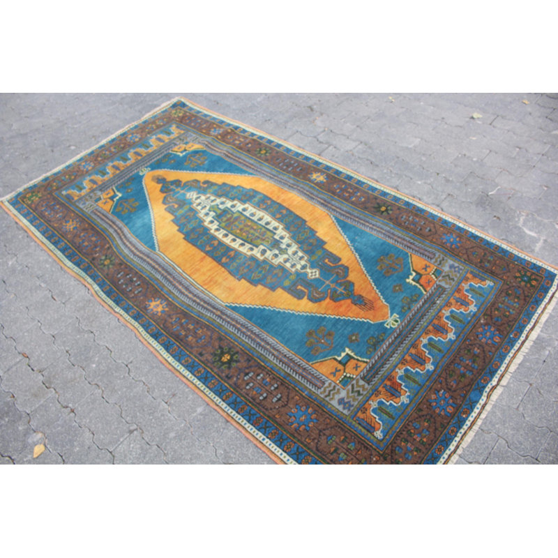 Tapis turc rétro en laine bleu: design antique d'Anatolie idéal pour la décoration de salon