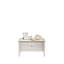 Table basse grise avec tiroir coulissant, design élégant et placement flexible – idéale pour exposer des objets.