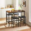 Ensemble de table de pub de style industriel avec chaises en cuir synthétique Geoffory pour manger et recevoir
