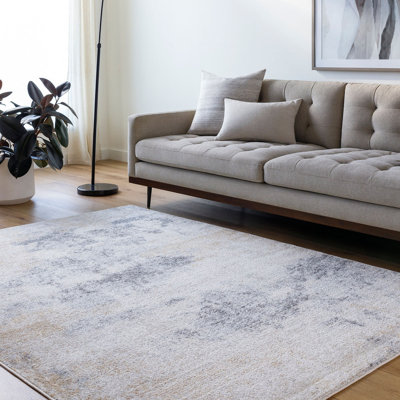 Blannie Abstract Machine Tufted Area Rug