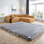 Canapé modulaire confortable en tissu brun surdimensionné avec coussins en mousse
