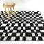 Tapis noir à carreaux abstrait Kieffer-937814424