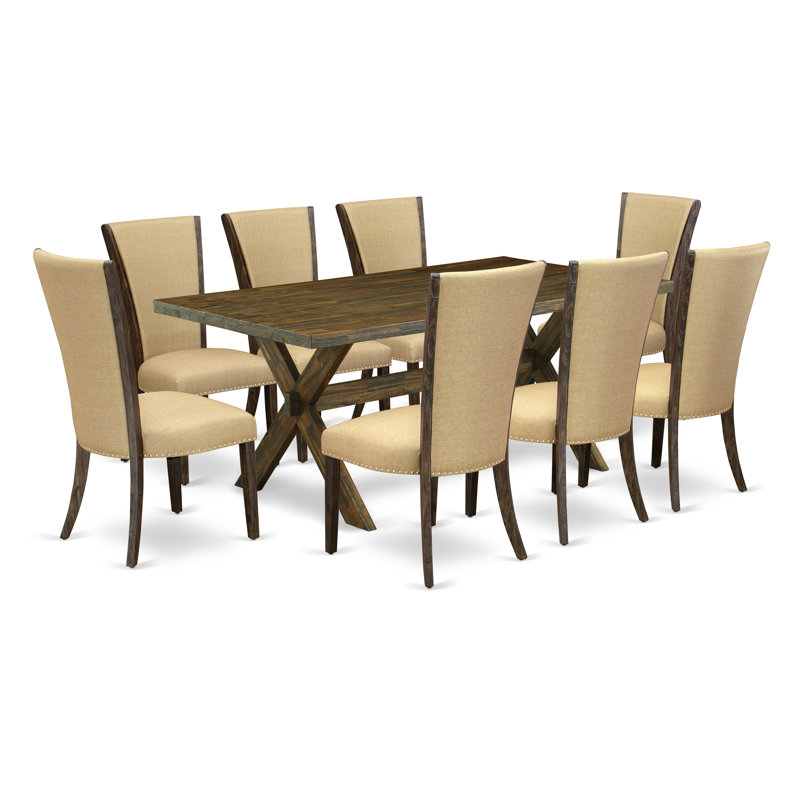 L'ensemble de mobilier de salle à manger 9 pièces comprend une table de salle à manger rectangulaire avec pieds en X et 8 chaises rembourrées en tissu brun, jacobin vieilli