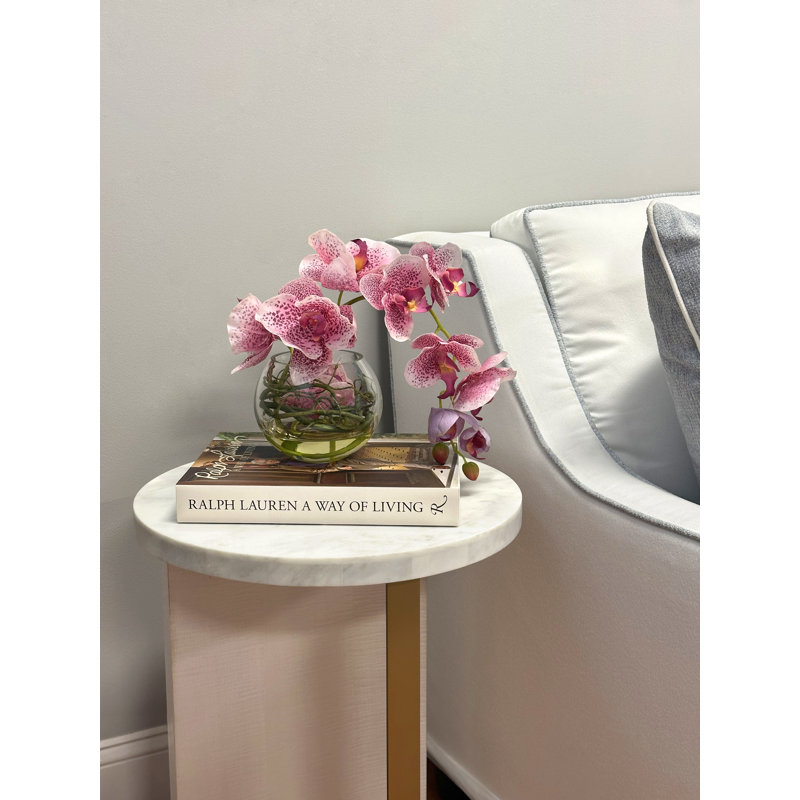 Orchids Arranged With Vines In A Clear Glass Bubble Bowl