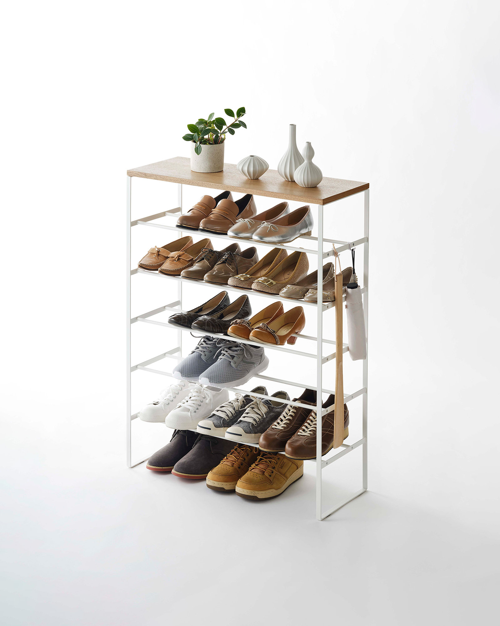 https://assets.wfcdn.com/im/24055566/compr-r85/2228/222832982/yamazaki-home-tier-wood-top-shoe-rack-steel-holds-18-to-21-shoes.jpg