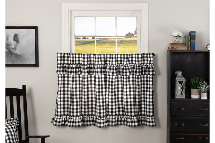 black and white gingham cafe curtain in a living room window