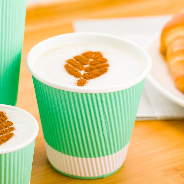 cappuccino and latte in disposable paper cups on a light
