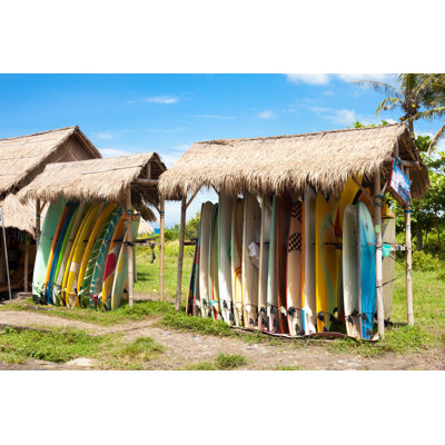 Surfboards in Rack by Calypte - Wrapped Canvas Photograph