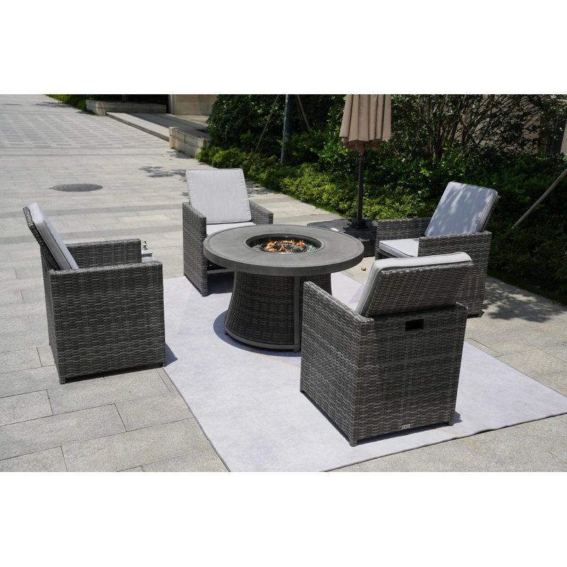 Areefa 4 - Person Wicker Patio Dining Set with Round Table
