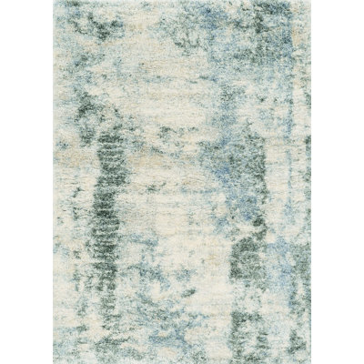 Tapis ivoire ou bleu en polypropylène 7 pi x 9 pi