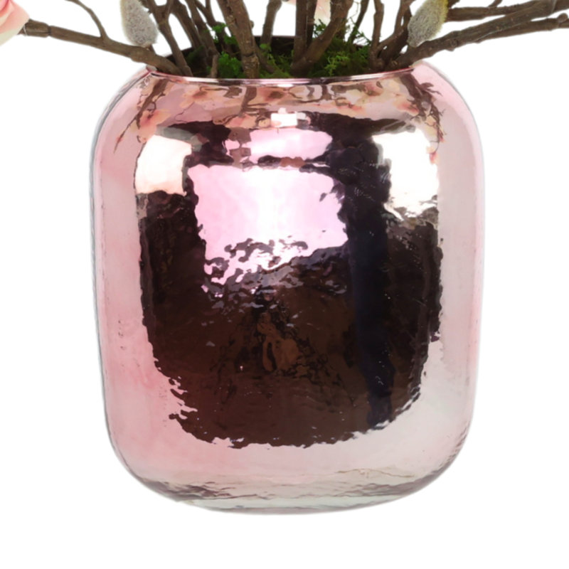 Papillons magnolia dans un vase en verre