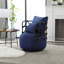 Fauteuil d'appoint confortable en lin texturé avec support en métal élégant
