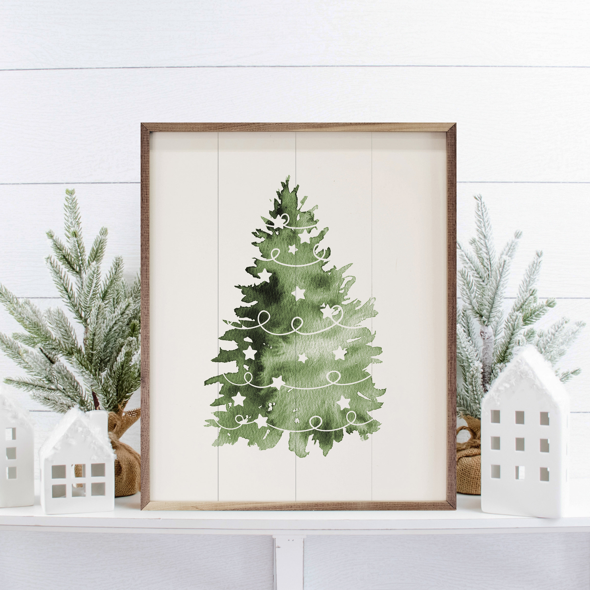 Painting of Christmas trees on an easel, palette, brush