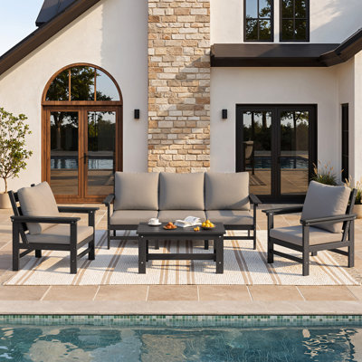 Ensemble de mobilier d'extérieur 4 pièces pour toutes saisons avec table basse et coussins amovibles résistants à l'eau