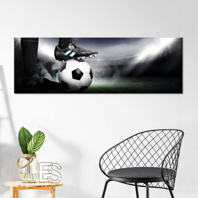 Crampons sur ballon de soccer sur toile