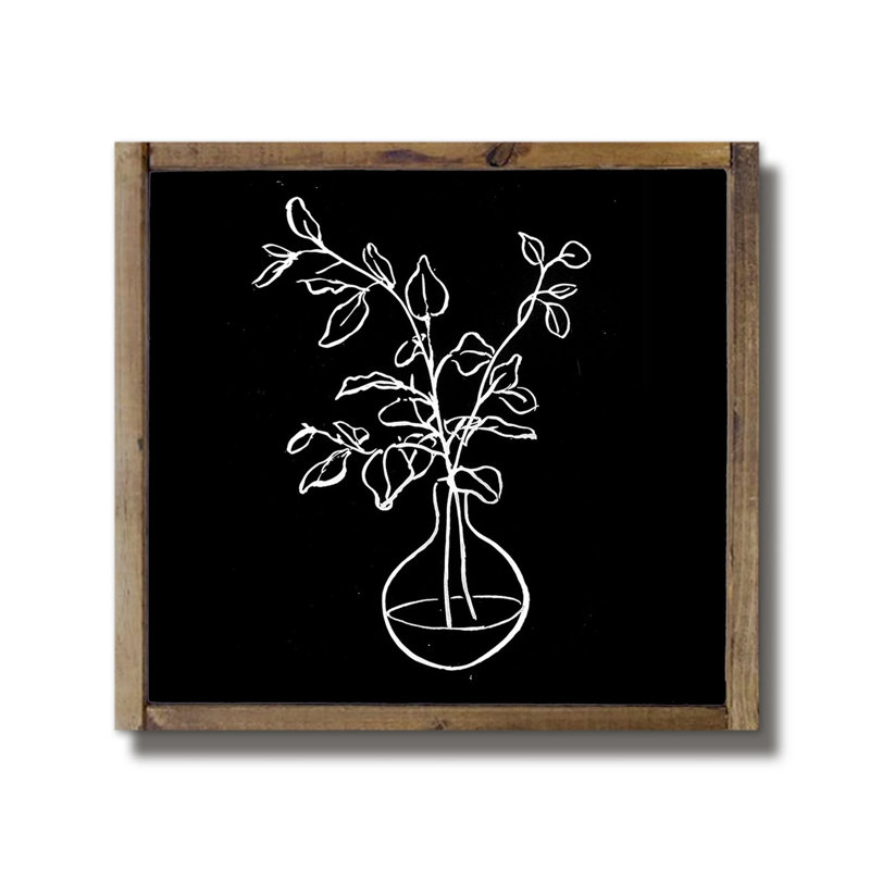 Motif floral noir et blanc encadré sur bois