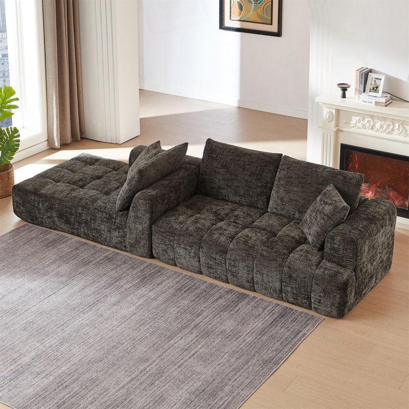 Canapé modulaire surdimensionné en forme de L avec un design minimaliste, une fonction de lit confortable et aucun assemblage requis pour une utilisation instantanée.