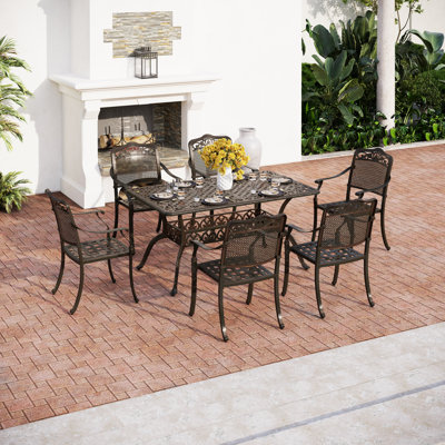 Aivars 6 - Person Patio Dining Set with Rectangular Table , Cushions Included