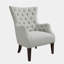 Fauteuil à oreilles capitonné