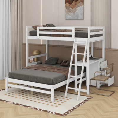 Lit simple superposé au dessus d'un lit double avec bureau et tiroirs