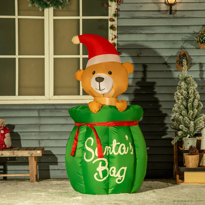 Ours dans un sac de père Noël gonflable