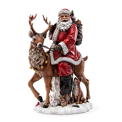 Père Noël chevauchant un renne