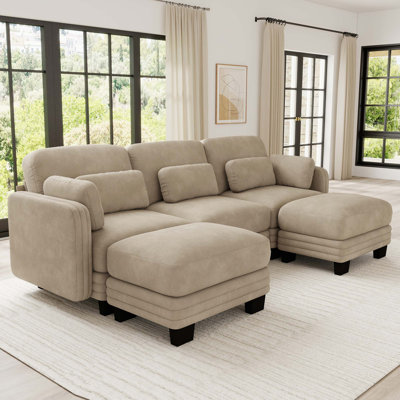 Canapé d'angle modulaire capitonné avec poufs amovibles