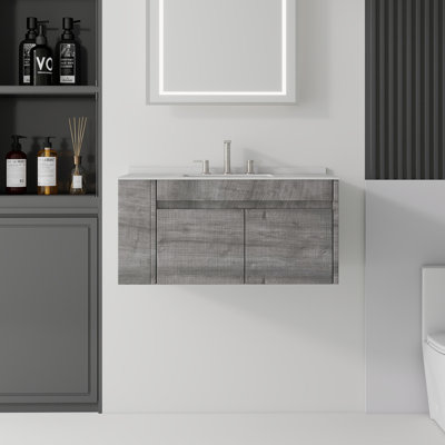 Meuble-lavabo suspendu de 91 cm (36 po) avec comptoir et dosseret en marbre reconstitué, armoire en contreplaqué, lavabo en céramique, 2 portes à fermeture amortie, tablette latérale ouverte, gris