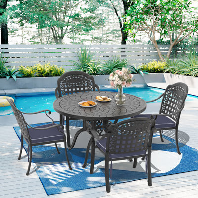 Ensemble de salle à manger rond pour patio 4 personnes 47,24 po avec 4 chaises empilables, coussins bleus
