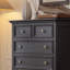 Armoire cinq tiroirs en bois massif noir avec pattes décoratives dorées