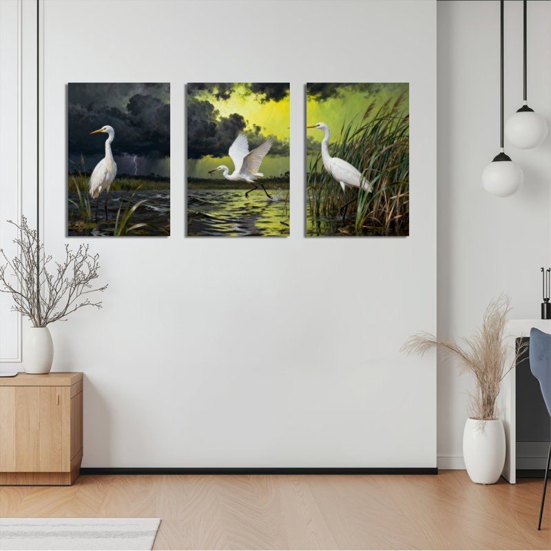 Ensemble de 3 tableaux sur toile tendue représentant un héron blanc dans un paysage marécageux, H 36 po x l 72 po