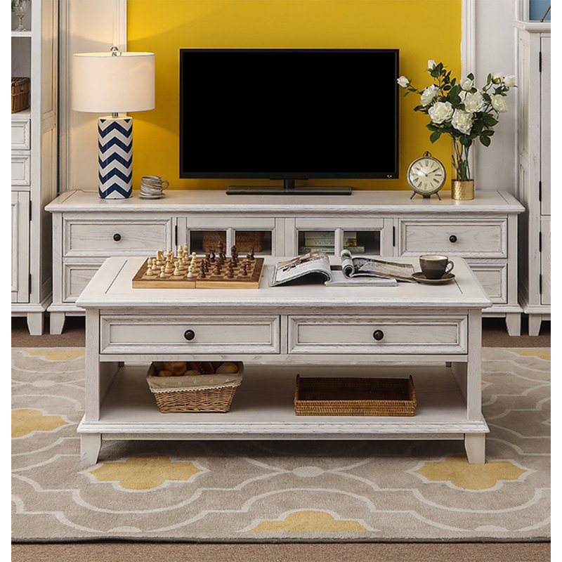 Four-drawer coffee table in solid white wood., 20.08" H x 49.21" L x 27.95" W