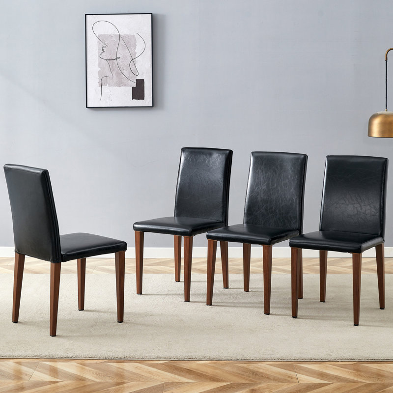 Ensemble de quatre pièces de chaises en polyuréthane simples et polyvalentes, idéales pour divers styles de décoration intérieure et expériences culinaires confortables