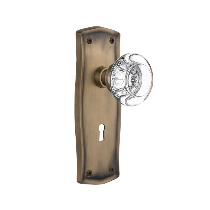 Double poignée de porte en cristal rond avec plaque longue serrure Prairie, Laiton antique