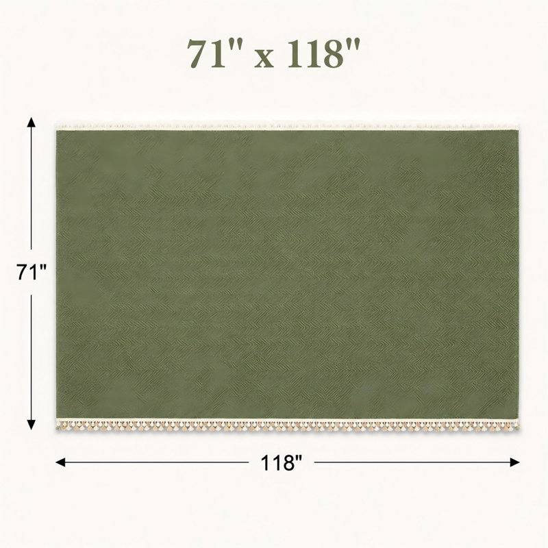 Housse de canapé verte en chenille à chevrons avec pompons