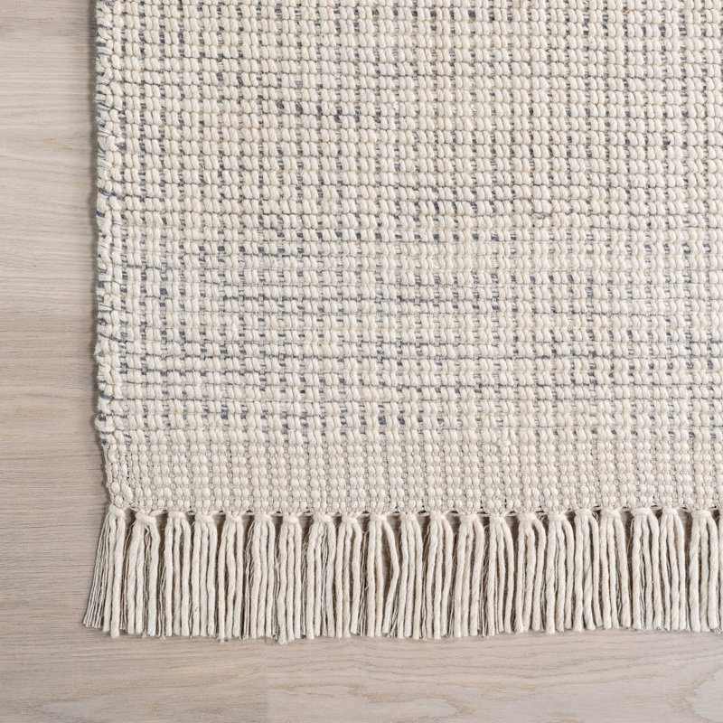 Handmade Ivory Wool Rectangular Area Rug with Fringe