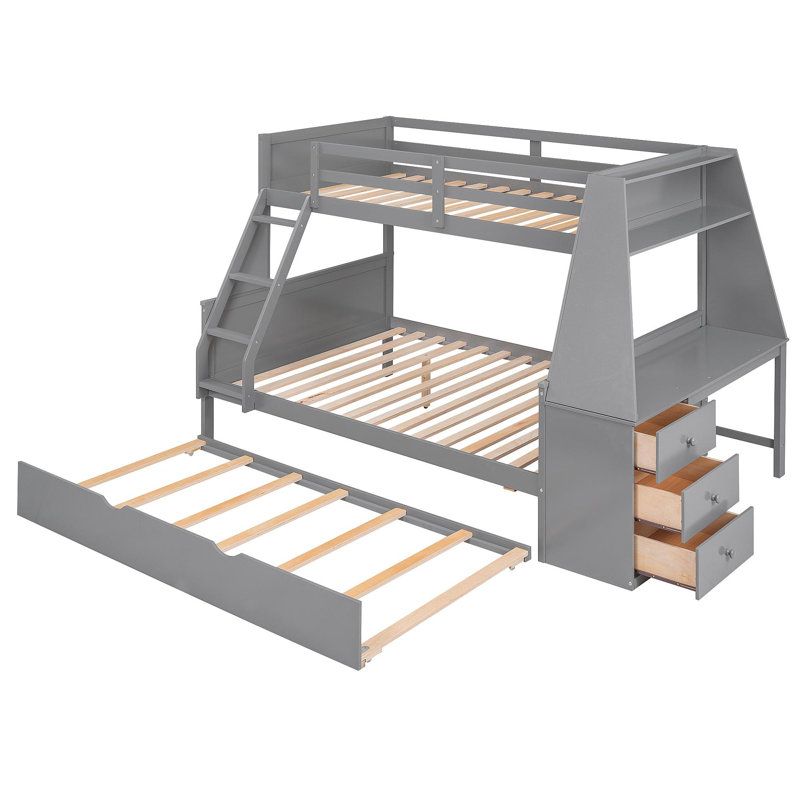 Lit simple superposé au dessus d'un lit double avec lit gigogne et bureau intégré, trois tiroirs de rangement et une tablette