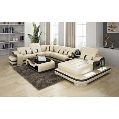 Canapé modulaire en cuir avec repose-pieds Arunvir Aphra