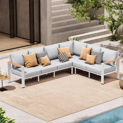 Canapé d'angle extérieur en forme de L pour 6 personnes (259 cm), avec coussins en oléfine de 15 cm et structure en aluminium.