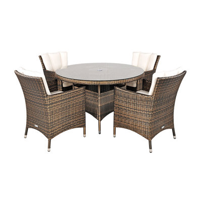 Harold 4 - Person Wicker Patio Dining Set with Round Table , Cushions Included