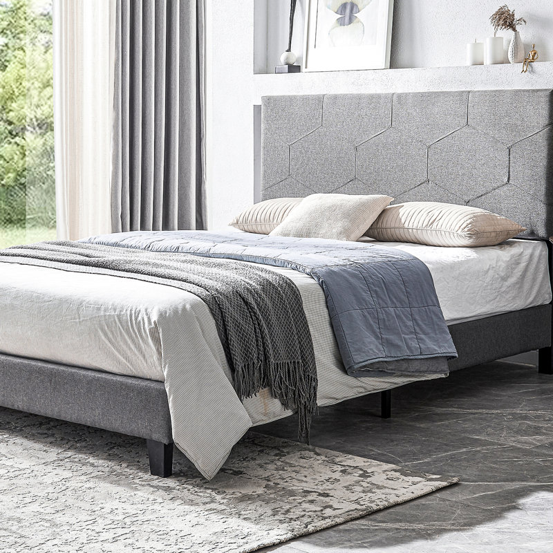 Lit tapissier grand, gris, pour une expérience de chambre à coucher paisible