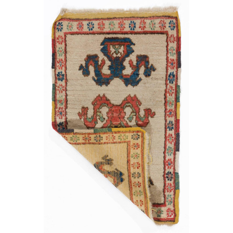 Tapis semi-antique avec bordure colorée. Housse de siège ou tapis de porte. Toute la laine