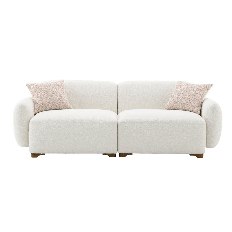 Boucle beige avec cadre intérieur robuste et sièges confortables à 2 coussins modernes