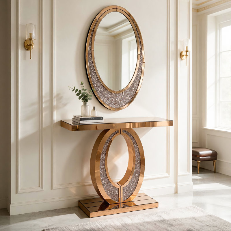 Console d'entrée dorée à miroir avec cadre ovale creux et incrustation de diamants concassés étincelants, table d'appoint décorative glamour pour hall d'entrée, salon ou vestibule.