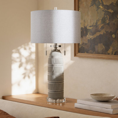 Lampe de table en pierre tissée