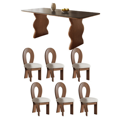 Élégants ensembles de tables de salle à manger en ardoise et en bois noirs.