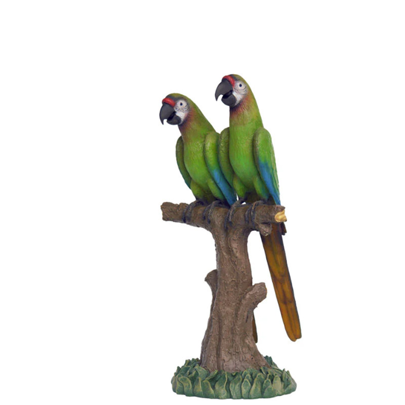 Statue verte grandeur nature perroquets sur une branche