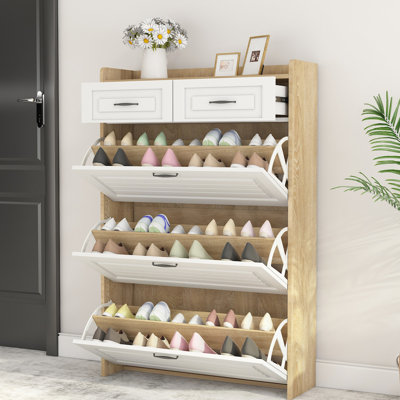 Le rangement à chaussures blanc et chêne avec 3 portes et 2 tiroirs rehausse l'esthétique de votre armoire brune et protège les chaussures de la saleté